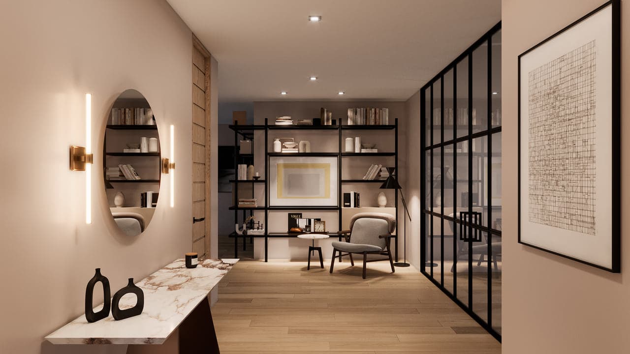 A foyer with a marble console table, an oval mirror, brass wall sconces and a black-framed glass partition leading to a seating area
