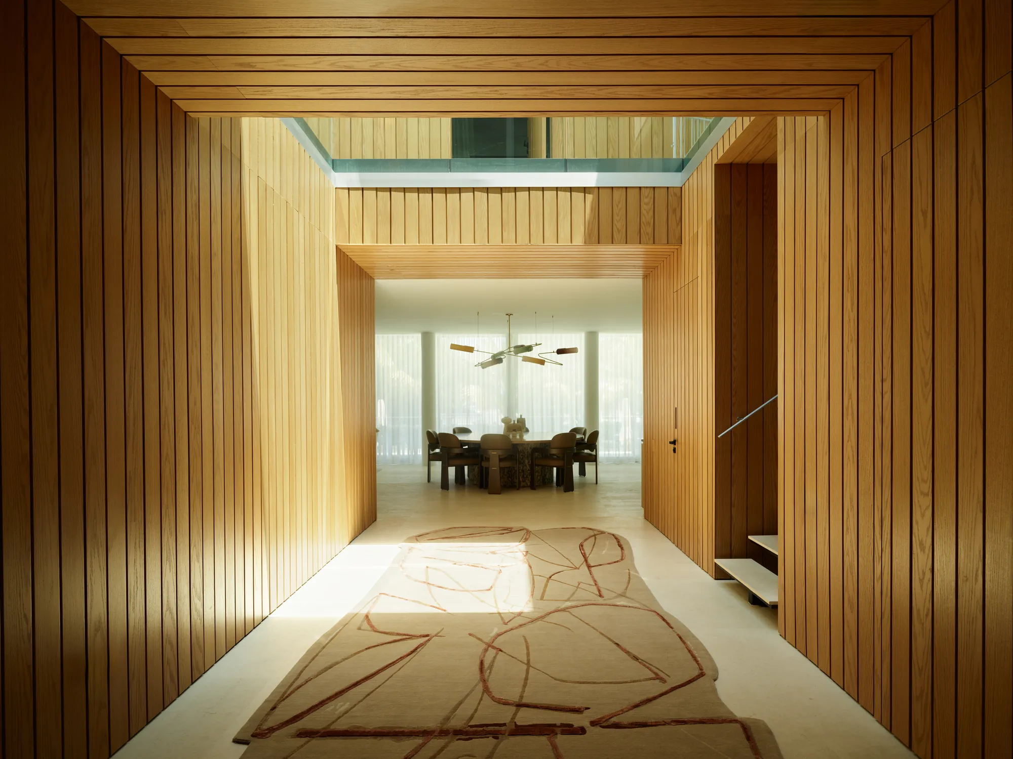 Warm minimalist interior lined in white oak in the Broadview residence by LUXOM, Miami