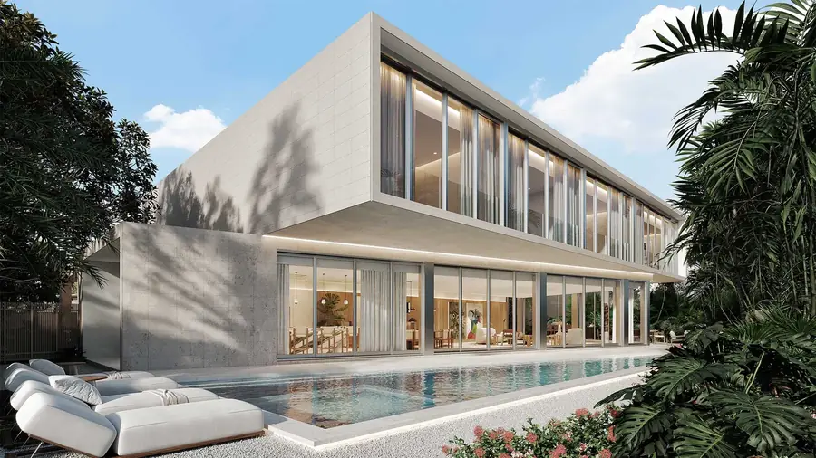 Stone and glass Luxom residence with a lap pool and mature landscaping