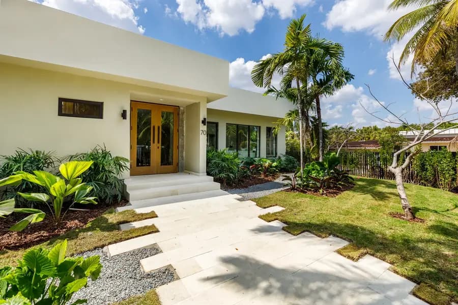 The finished exterior and entry of the Samana Residence at 70 Samana Dr in Coconut Grove, Miami, the same home built start to finish in Luxom's empty lot to dream home timelapse